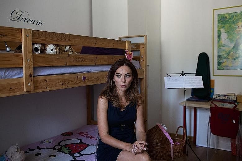 Journalist Vittoria Iacovella at her home in Rome on Tuesday. Many companies do not offer flexible hours for working mothers.
