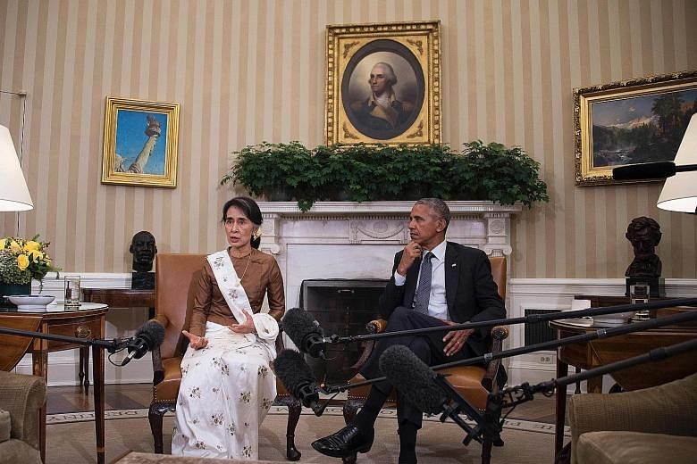 Ms Suu Kyi with Mr Obama at the White House on Wednesday. Both leaders feel Myanmar is now in a position to open up to investors keen to take part in its economy, which is expected to grow 8.4 per cent this year.