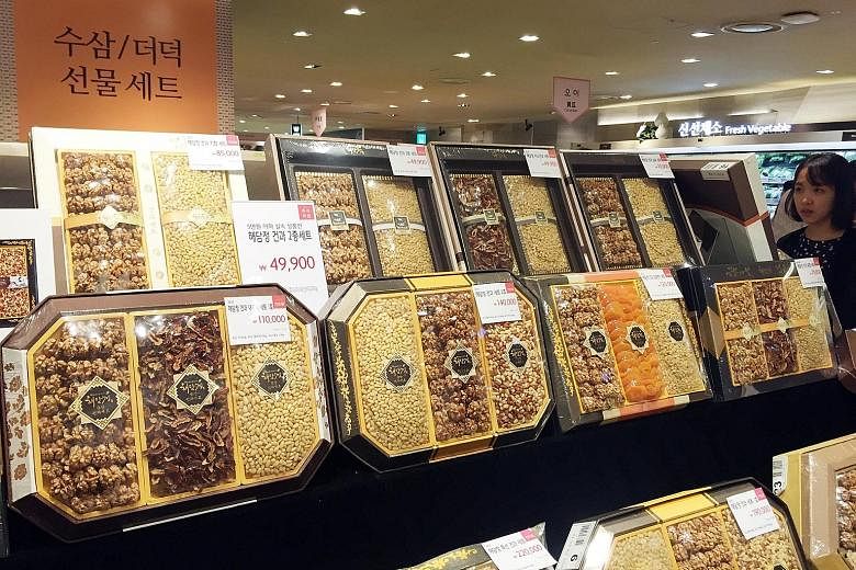 Gift sets priced below 50,000 won (S$60) - the limit set by an impending anti-graft law for gifts for civil servants, teachers and journalists - on display at a department store before the three-day Chuseok holiday which began on Wednesday.
