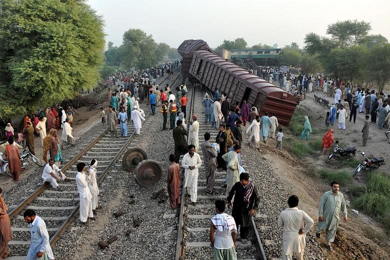 At least four people were killed and more than 100 injured when two trains collided in central Pakistan early yesterday, officials said. The accident occurred near the city of Multan around 2.30am when the Karachi-bound Awami Express passenger train 