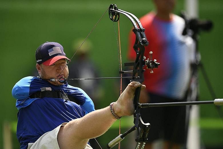 American Matt Stutzman, who has no arms, during the Paralympics archery individual compound qualifying at the Sambodrome. He won silver in London but missed the quarter-finals by a single point in Rio. To shoot, he sits, holding the bow out with his 