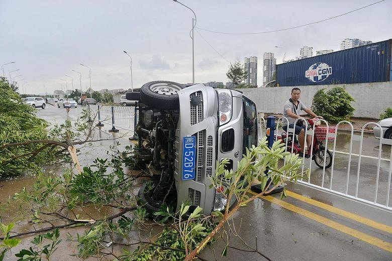 A vehicle turned over by Typhoon Meranti, which hit Xiamen in Fujian province yesterday. The super typhoon is the most powerful to hit the province in at least 67 years.