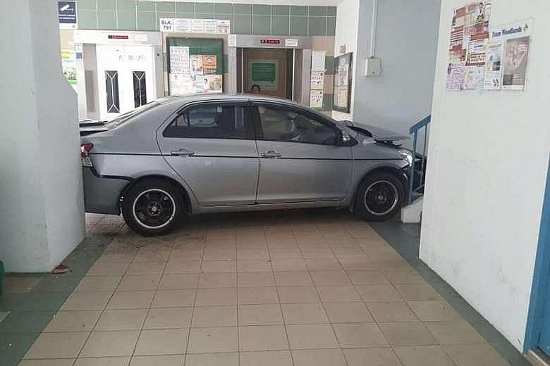 A car crashed into the void deck of a Housing Board block in Woodlands yesterday afternoon. The silver sedan was wedged between a stairwell and a wall in front of the lift lobby at Block 791, Woodlands Avenue 6. The Singapore Civil Defence Force (SCD
