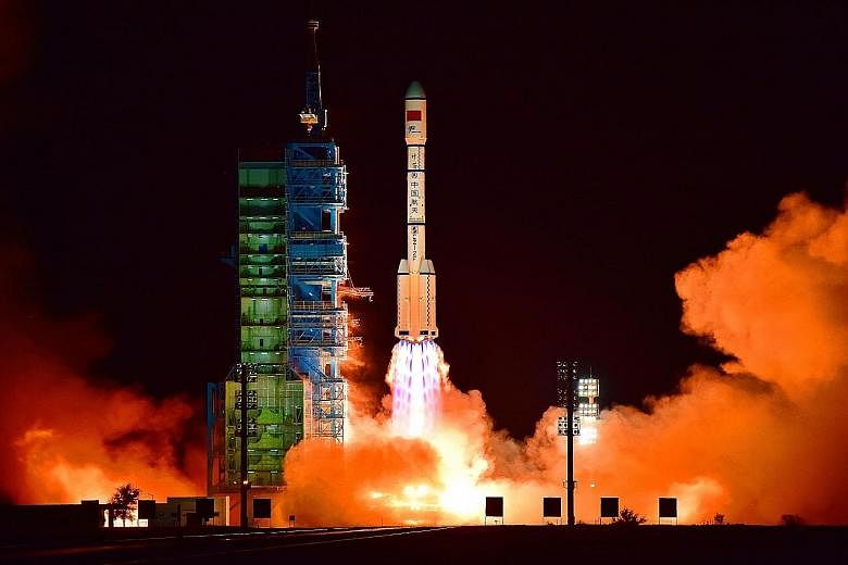 China's Tiangong 2 space laboratory being launched from the Jiuquan Satellite Launch Centre in the Gobi Desert, in Gansu province, on Thursday. The Shenzhou 11 spacecraft, which will carry two astronauts and dock with Tiangong 2, will be launched som