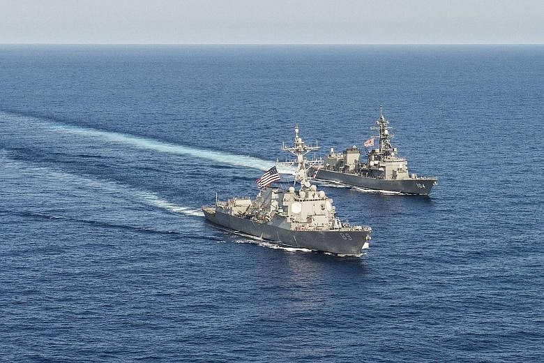 US and Japanese military vessels during bilateral training in the South China Sea in April last year. Japan's increased engagement in the South China Sea would include capacity building for coastal nations, said Defence Minister Tomomi Inada.