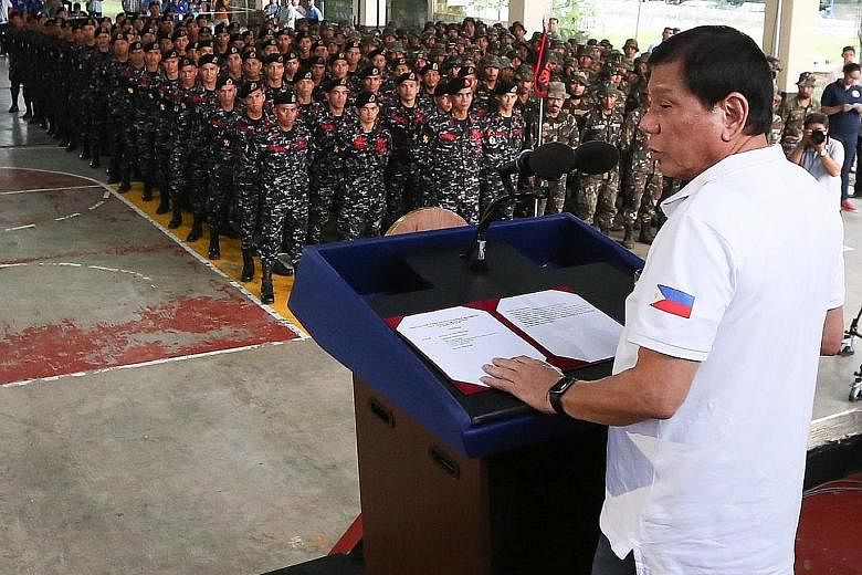 President Duterte addressing the Philippine Army Scout Rangers at their headquarters in San Miguel on Thursday. Mr Duterte has been accused of giving orders to kill not just criminals but also his opponents.