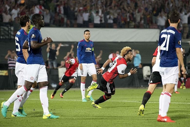 Tonny Vilhena (in red) of Feyenoord celebrating after scoring against Manchester United in their Europa League clash. The match ended 1-0 in favour of Feyenoord and gave Jose Mourinho a second successive defeat as United manager.