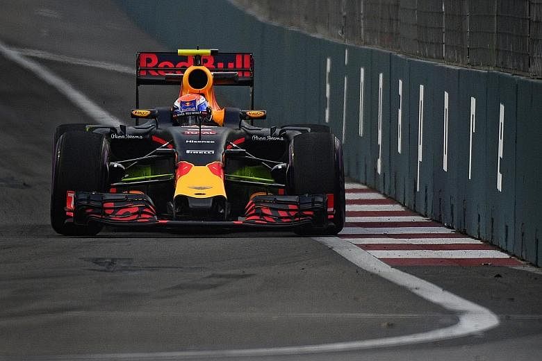 Red Bull's Max Verstappen approaching Turn 14 during the first Singapore Grand Prix practice session at the Marina Bay street circuit. The Dutchman completed the third fastest lap of the day in 1min 44.532sec, 0.380sec behind the pace-setter Nico Ros