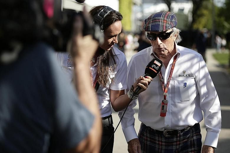 Formula 1 legend Jackie Stewart speaking to the media at the paddock of the Marina Bay street circuit yesterday. The Scot did not mince his words when it came to the rivalry between Mercedes' Lewis Hamilton and Nico Rosberg, calling them out for one 