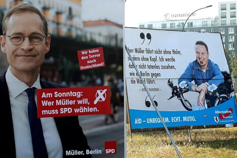 Election posters for Mr Mueller of the Social Democratic Party and Mr Pazderski of the anti-immigration party Alternative for Germany in Berlin. The German city prides itself on being culturally diverse and tolerant.
