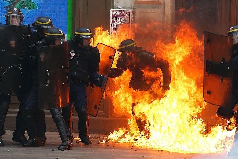 Four protesters and 15 police officers were hurt on Thursday, including two officers who sustained burns when demonstrators hurled Molotov cocktails.