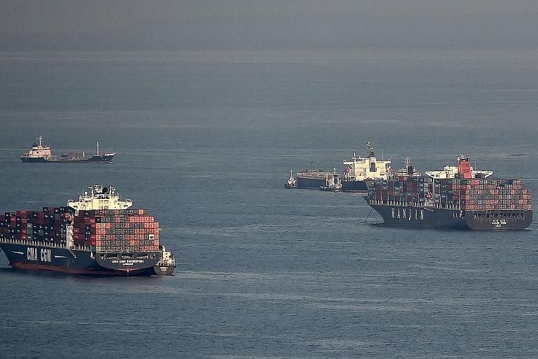 A Hanjin vessel (at right) anchored off Singapore this week. The South Korean container line has filed for receivership - the latest casualty of the slump in global shipping.