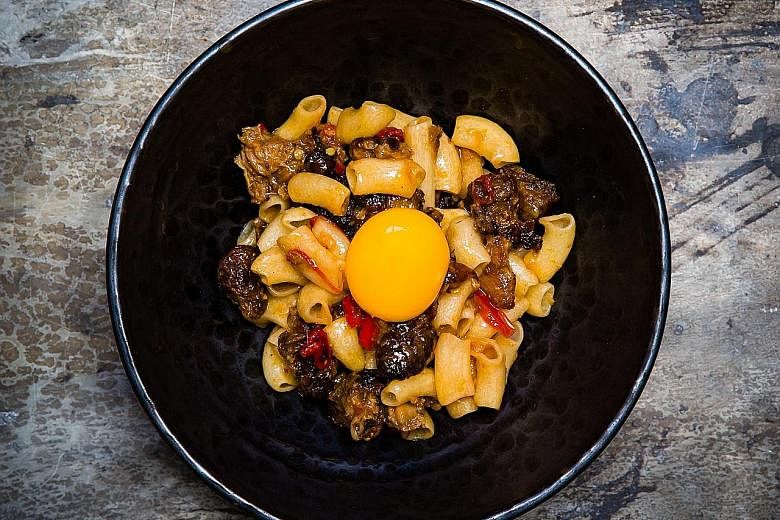Among the 10 dishes chef Mitchell Orr served at a guest cooking stint in Singapore recently were Macaroni, Pig's Head, Egg Yolk (above) and Baloney Sandwich.
