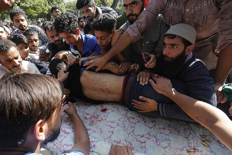 The funeral of schoolboy Nasir Shafi Qaz was held in New Theed village yesterday. His body was found riddled with pellets last Friday after clashes between demonstrators and security forces.