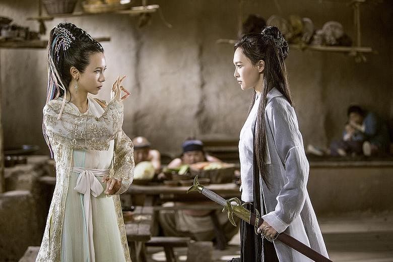 Karen Mok (far left) as the demon, Bak Jing-jing, and Tiffany Tang as fairy Zixia in A Chinese Odyssey Part Three.