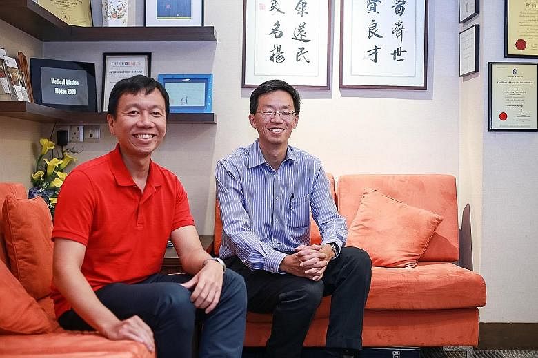 Nose cancer survivor Wongso Shianturi Wijaya (far left) and surgeon Andrew Loy. Dr Loy found a 2cm tumour deep inside Mr Wongso's nose after the latter complained of persistent nosebleeds following a traffic accident.