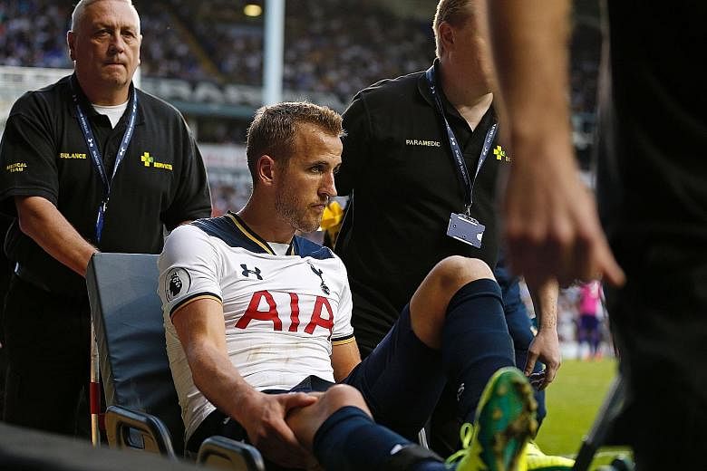 Tottenham striker Harry Kane being wheeled away on a stretcher after twisting his ankle against Sunderland in their Premier League game on Sunday. The likelihood is that he has grade two ligament damage.