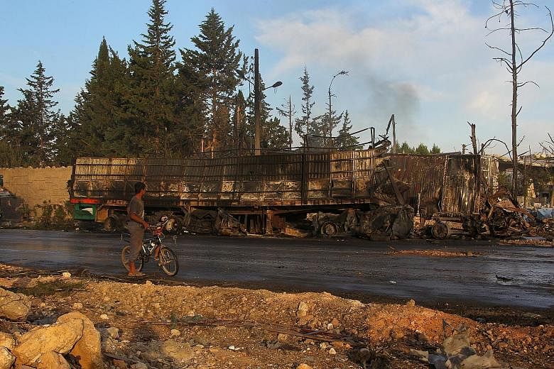 An aid truck destroyed in Monday night's strike, which hit at least 18 of 31 vehicles delivering aid under a joint UN, Red Cross and Red Crescent operation for the town of Orum al-Kubra in Aleppo province. Several civilians were killed, including a s
