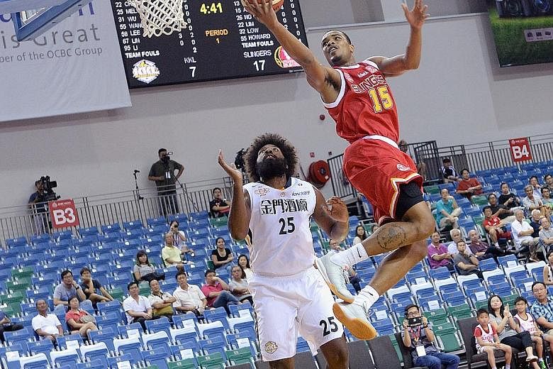 The Singapore Slingers' American import Xavier Alexander driving to the basket in the Merlion Cup opening Group A game at the OCBC Arena yesterday evening. The forward scored 21 points and team-mate Justin Howard added 20 points to give the team a 79