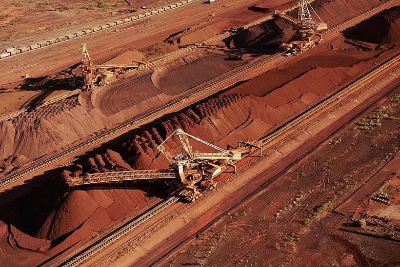 BHP Billiton's iron ore stockpiles. The Australian Tax Office says the miner needs to pay US$766 million (S$1.04 billion) in back taxes and charges for its Singapore commodities marketing hub.