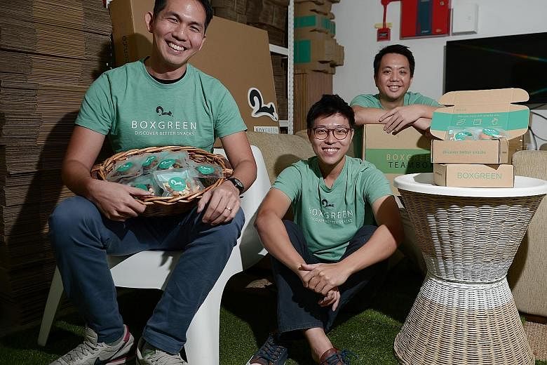 From left: Andrew Lim, 31, Walter Oh, 29, and Wong Weng Fai, 34, are the co-founders of BoxGreen, a start-up that runs a subscription service for healthy snacks. The trio has recently expanded their business to Malaysia and hopes to enter markets suc