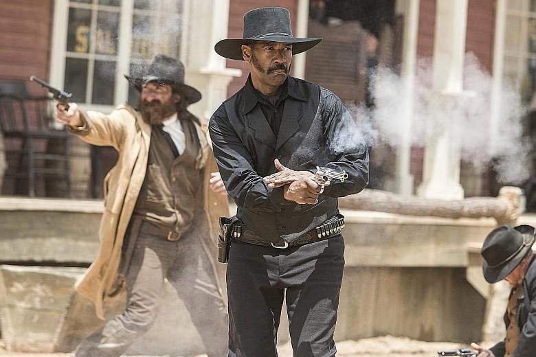 Denzel Washington (left) plays the African- American leader in The Magnificent Seven.