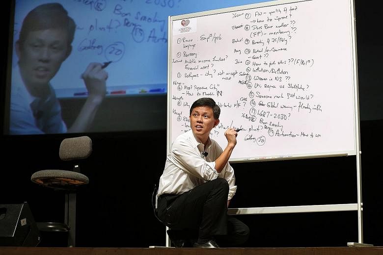 Mr Chan responding to questions put to him by polytechnic students at yesterday's dialogue.