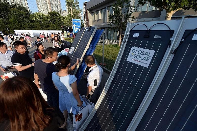 Solar panels on display at a recent clean energy event in Beijing. China has been the single largest developer of clean energy technology for eight years.