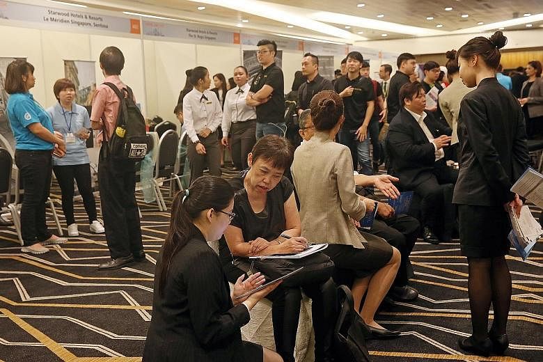 Job seekers at the hotel career fair yesterday. The hotel sector, which employs 35,000 people, has about 2,100 vacancies, of which 40 per cent are for PMETs.