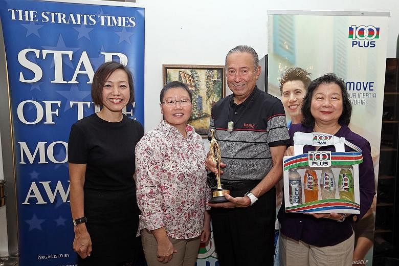 Joseph Schooling's parents Colin and May receiving The Straits Times' Star of the Month award for August on their son's behalf on Thursday. The award was presented by Jennifer See, the general manager of F&N Foods Singapore (extreme left) and Lee Yul