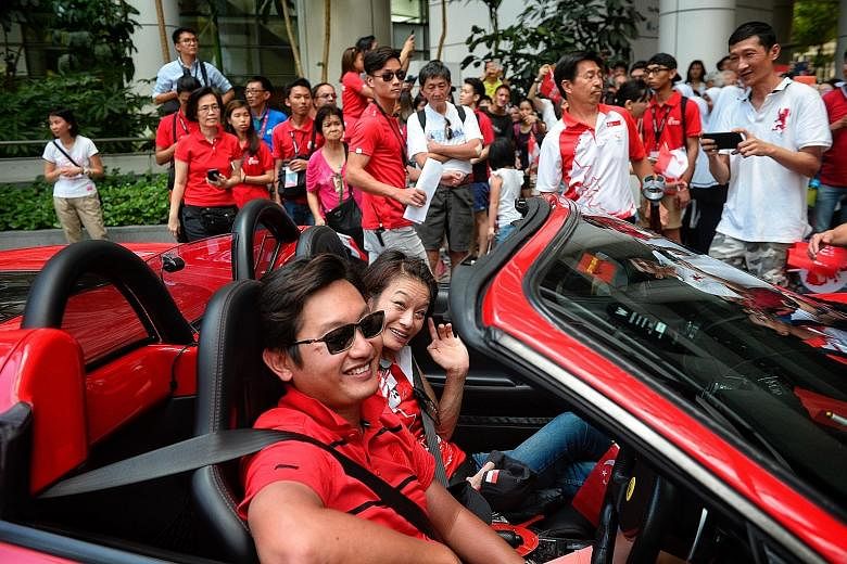 Equestrian para-athlete Laurentia Tan waves as she arrives at the National Library, the second stop of yesterday's Team Singapore celebratory parade for the Rio Paralympians and (below) swimmer Yip Pin Xiu, who won two gold medals in Brazil, en route