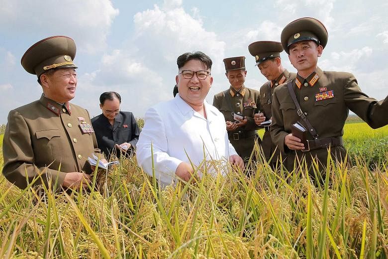 North Korean leader Kim Jong Un with military officials in an undated photo from the Korean Central News Agency in Pyongyang. This year alone, the North has held two nuclear tests and test-fired more than 20 missiles.