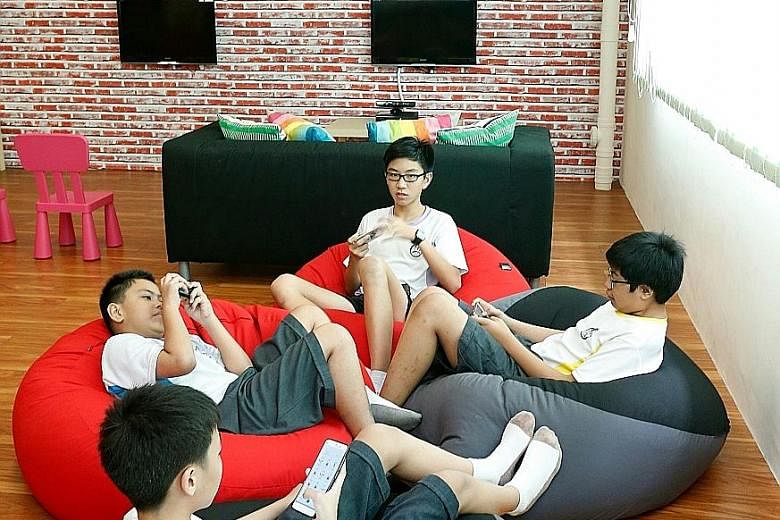 Kent Ridge Secondary School students enjoying the facilities at its after-school centre, KR Lighthouse.