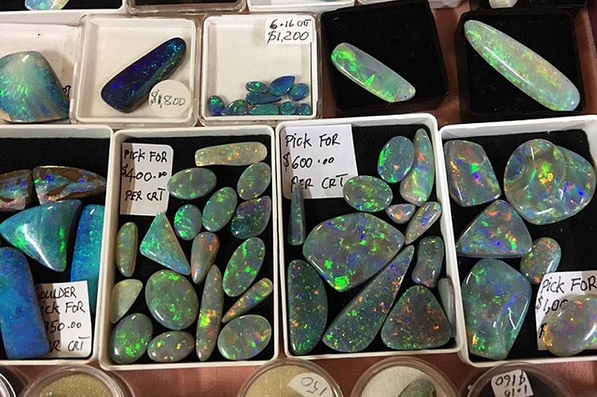 Above: The Virgin Rainbow, one of the most spectacular opals ever discovered. Right: Opal prices have soared in the past 18 months. Mr Dunstan, who discovered the Virgin Rainbow 13 years ago, says there is little doubt there are still big finds waiti