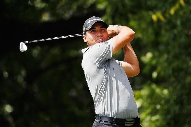 Jason Day hitting his tee shot on the second hole in the Tour Championship's second round. The Australian world No. 1 was playing decently, but withdrew after seven holes at overall three under as a precautionary measure. While he had said earlier th