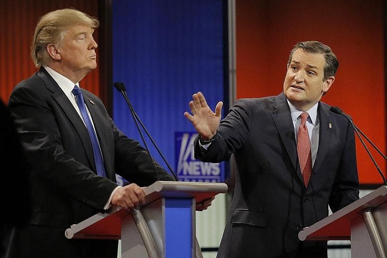 Mr Cruz (right) and Mr Trump at a Republican presidential candidate debate. The primary campaign was a bitter one, and the senator had even refused to endorse Mr Trump at the Republican National Convention.