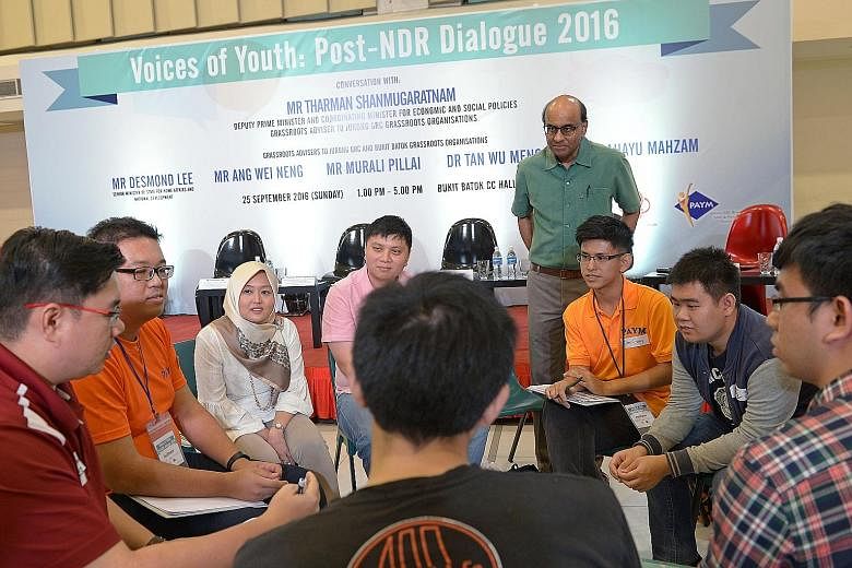 Mr Tharman and Jurong GRC MP Rahayu Mahzam (third from left) at a small group discussion with young people yesterday. After the discussions, participants took part in a dialogue with MPs from Jurong GRC and Bukit Batok, where they discussed issues ra