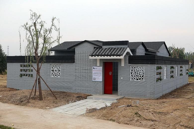 A villa built by 3D printing technology at a village in Binzhou, eastern China's Shandong province. The 3D-printed villa which uses no bricks in its construction costs 5,000 yuan (S$1,000) per sq m. Three months ago, a Chinese company 3D-printed a tw