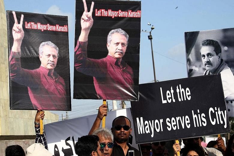 Supporters of Karachi's newly elected mayor Waseem Akhter rallying to demand his release from prison in Pakistan's largest city on Sunday. Akhter has been discharging his mayoral duties from a jail cell, where he has been held for inciting riots in 2