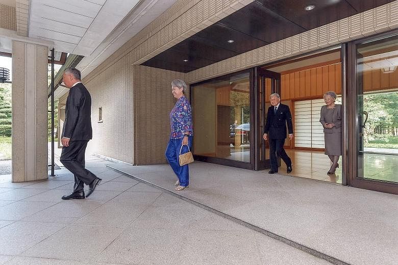 Japanese Emperor Akihito and Empress Michiko seeing off PM Lee and Mrs Lee after their private lunch at the Imperial Palace yesterday. PM Lee is in Tokyo for a four-day official visit that started on Monday, to mark 50 years of diplomatic ties betwee