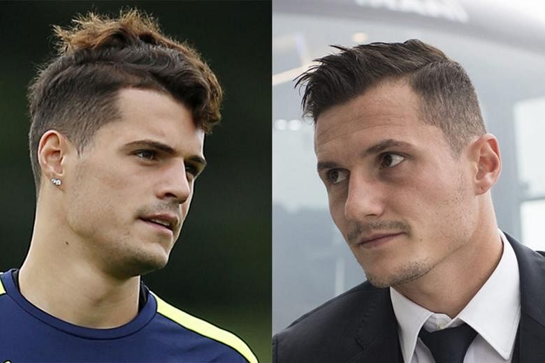 Midfielder Granit Xhaka (left) has started just two games for Arsenal but could find himself going up against his brother Taulant of Swiss club Basel in the Champions League today.