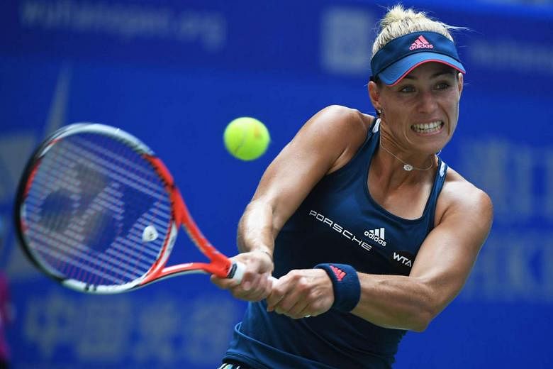Angelique Kerber hitting a backhand during her second round match against Kristina Mladenovic of France at the Wuhan Open. The top-ranked German let two set points slip in the first set but bounced back to earn a meeting with Petra Kvitova today. 
