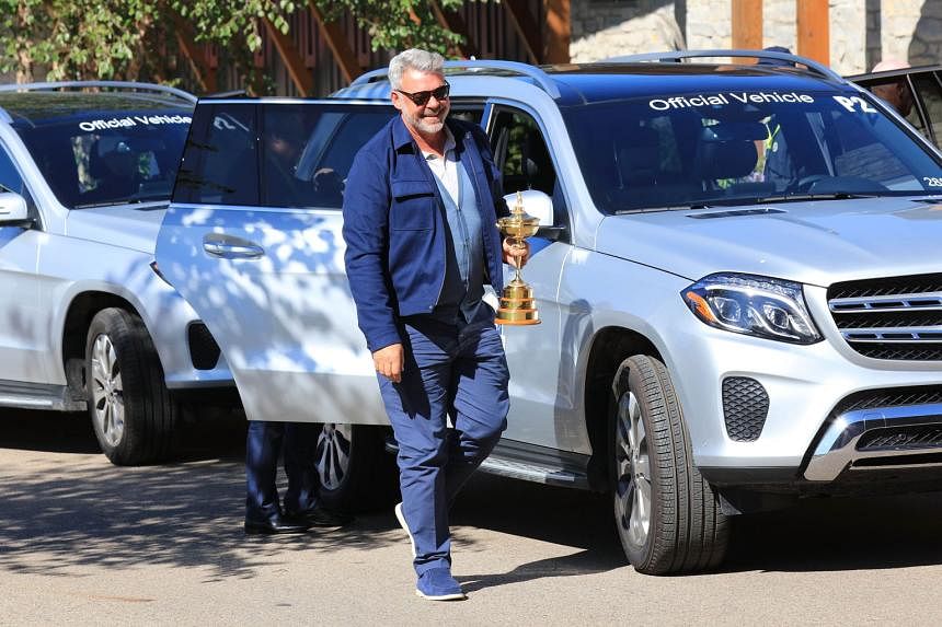 Above: Team Europe Captain Darren Clarke arrives at Hazeltine with the Ryder Cup trophy. Europe have won eight of the last 10 editions of the biennial event. 