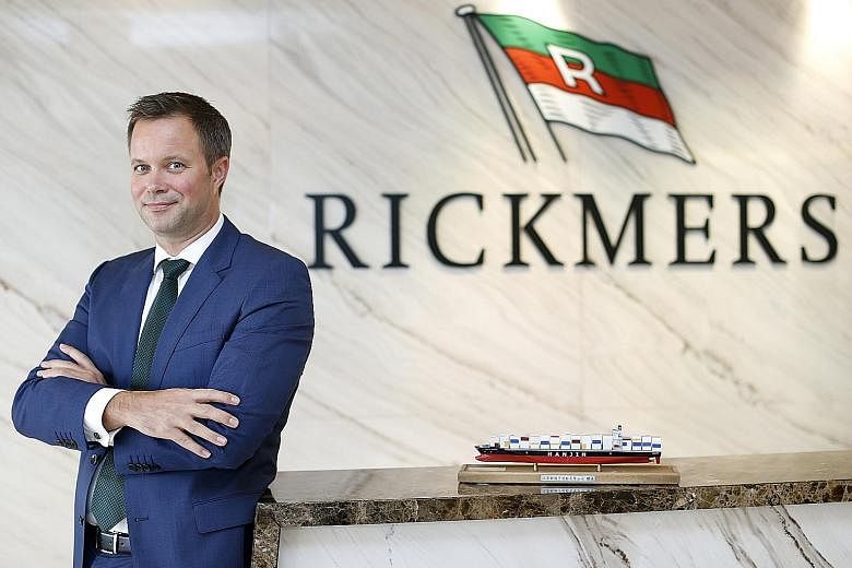 Note holders (left) filing an acceleration notice to trustee DB International Trust yesterday against Rickmers Trust Management, led by chief executive Soeren Andersen (above)