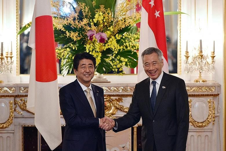 Prime Minister Lee Hsien Loong meeting his Japanese counterpart Shinzo Abe at the state guest house in Tokyo yesterday. Their bilateral meeting was the leaders' ninth since 2013.