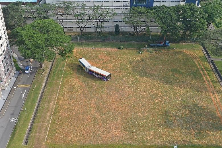 An SMRT bendy bus was stuck on a field behind Block 195, Kim Keat Avenue, for about 10 hours before it was finally towed away yesterday morning. The bus driver was returning the off-service vehicle to the depot in the early hours of the morning when 
