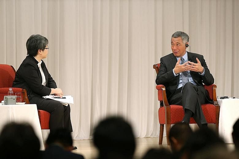 Mr Lee speaking at a session moderated by Nikkei Asian Review editor- in-chief Sonoko Watanabe at the Imperial Hotel in Tokyo yesterday. Mr Lee said he hopes Japan will continue to play an "active and constructive role" in Asia, especially South-east