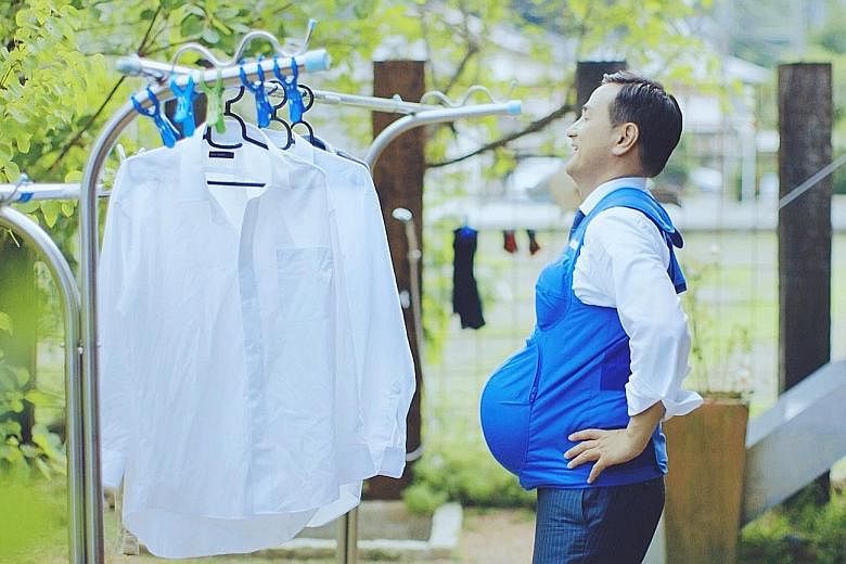 Mr Tsugumasa Muraoka, governor of Yamaguchi prefecture, wearing a vest that recreates the breasts and belly of a woman who is seven months' pregnant, in a video called The Governor Is A Pregnant Woman. In Japan, where women do five times as much hous