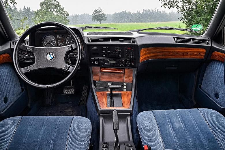 The 1983 BMW 745i (far left) features the oil change and service indicator lights on the instrument panel (top), while the 2016 BMW 750Li (left) has an intuitive cockpit (above) and is fully digitised and electrically powered.