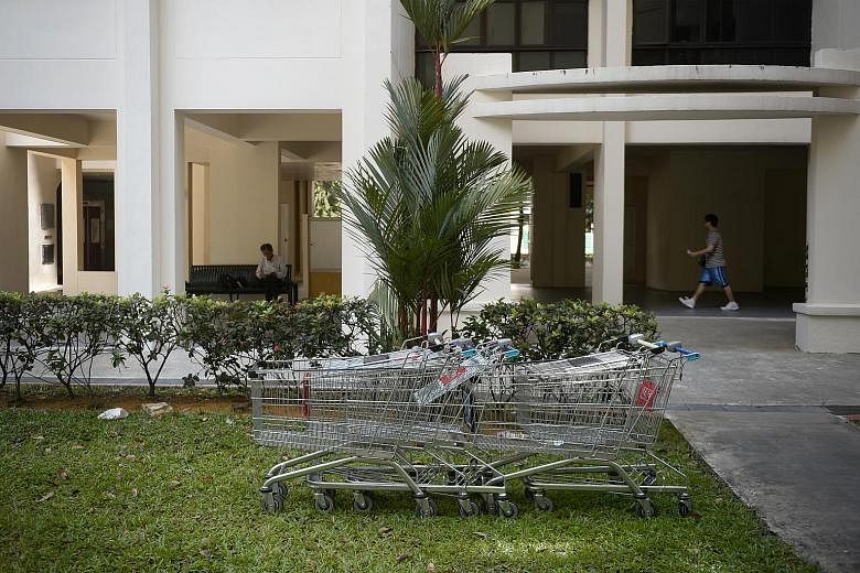 Trolleys found abandoned near a block in Jurong West. Last month, "trolley enforcement officers" were introduced by FairPrice at Jurong Point.